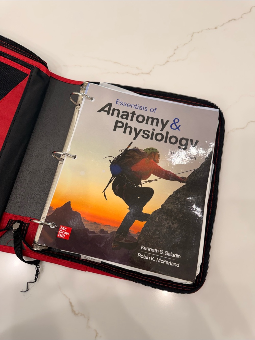 Essentials of Anatomy & Physiology Textbook in Black and Red Binder loose leaf